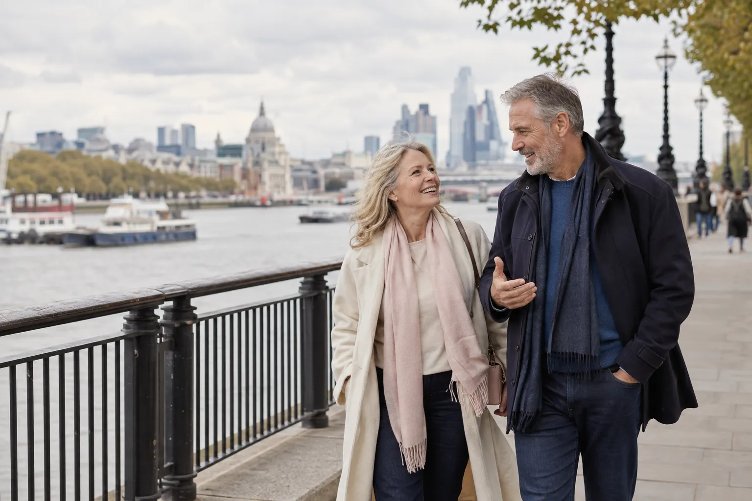 A couple over 50 talking on a public riverside walk in London